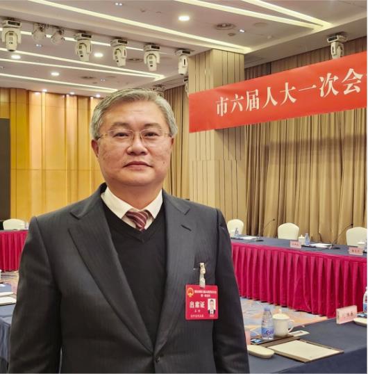 重庆市人大代表、轨道集团董事长王峙。受访者供图